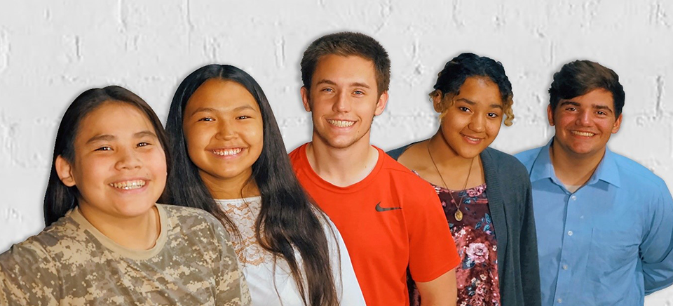 Five students standing in a row